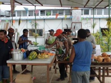 REL kitchen and housekeeping team preparing food at camp