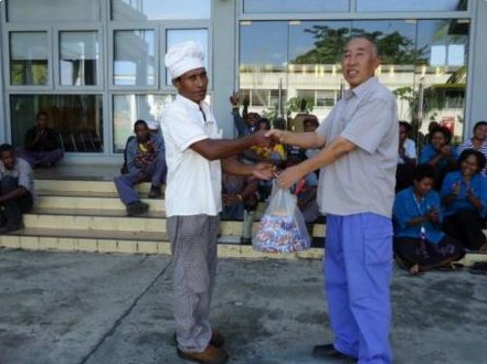 Raibus Engineering Ltd staff presenting a community support gift to a local worker